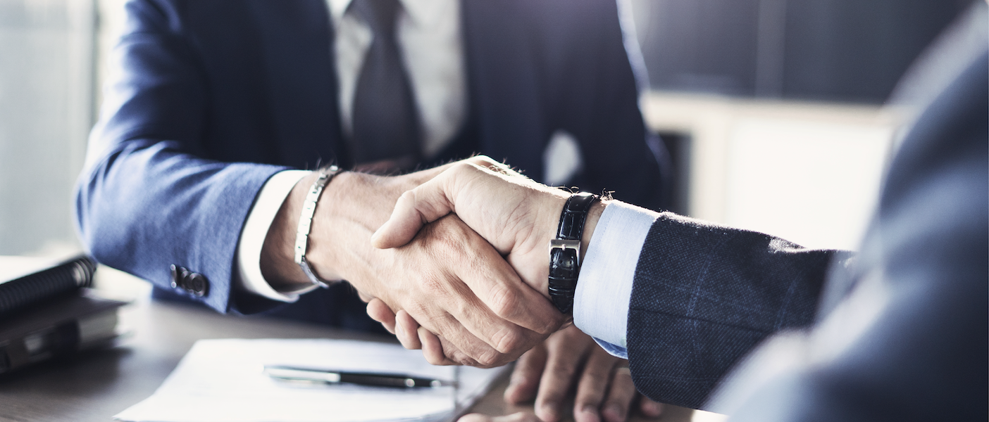 Two business men shaking hands